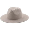 Close-up of lightweight brown straw fedora hat featuring fine woven texture and brim - Gray