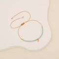 Handmade woven crystal bead bracelet with a gold heart pendant and adjustable cord - Transparent Green