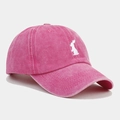 Detail view of pink washed cotton baseball cap with white rabbit embroidery on the side - Adjustable / Rose Red
