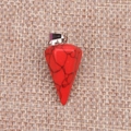 Close-up of red faceted stone cone pendant with black veins and silver metal bail - Red Turquoise