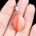 Flat teardrop red agate stone pendant with silver clasp held in hand for jewelry DIY - Red Agate (1pc)