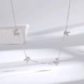 Elegant S925 sterling silver MAMA letter necklace with pavé diamonds on a white background - 925 Silver / White Gold