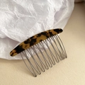 Macro shot of tortoiseshell acetate comb with polished silver metal teeth for hair styling - 10-Teeth Hair Comb / Dark Leopard