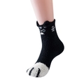 Close-up of fuzzy coral fleece mid-calf socks with cute black and white cat paw pattern - One Size / Black