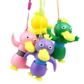 Colorful telescopic tube duck toys in pink, yellow, green and purple on white background - Stretch Duck