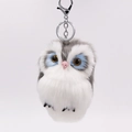 Fuffy grey and white plush owl keychain with blue eyes and metal clasp on white background - Gray
