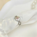 Detailed macro of vintage silver star ring with pink gemstone on white silk fabric - Adjustable Open / Silver with Pink Zirconia