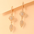 Macro view of gold-plated hollow leaf earrings with sparkling zircon floral accents - EH091 Geometric Flower Leaf Style