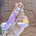 Purple Sanrio My Melody and duckling glitter tea cup keychain with silicone wrist strap - Perfume Bottle