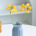 Handcrafted yellow crochet daisies with green stems in a blue geometric glass vase - 5-Head Forget-Me-Not Yellow
