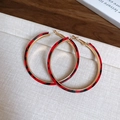 Detail of gold hoops with red leopard print leather texture on a display tray - Silver Earring Post-Gold-Red