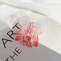 Pink gradient butterfly claw clip in transparent resin on an artistic book background - Gradient Red Butterfly Claw Clip / Gradient Red
