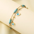 Detailansicht der doppellagigen Gold-Fußkette mit blauem Naturstein und Evil Eye Anhängern - Böser Blick Türkis Stil (KJ4306-SXSJ)