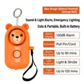 Orange bear-shaped personal alarm with 130dB sound, LED light and metal keychain - Chinese Packaging / Bear / Orange