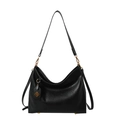 Black large-capacity tote bag in soft leather with golden hardware and charm detail - Black