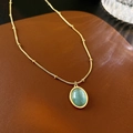 Elegante goldene Schlangenkette mit einem ovalen grünen Katzenaugen-Anhänger - Stil 19# Halskette-Grüner Katzenaugenstein Schlangenkette