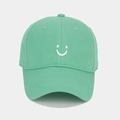 Detailed view of mint green baseball cap with white smiley face embroidery - Adjustable / Peacock Blue (Mint Green)