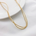 Collana minimalista con perline quadrate in ematite dorata su sfondo bianco puro - Perla Distanziatrice a Tubo (9#) / 1.3*1.5mm (1 Filo) / Oro