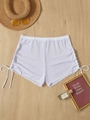 Detail of white mesh beach shorts showing the side drawstring and sheer fabric texture - XS / Bottoms / White