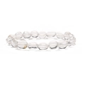 Macro shot of natural crystal quartz bracelet with transparent round flat beads and ice cracks - White Crystal