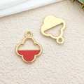 Golden alloy four-leaf clover charm with red enamel inlay on beige fabric background - 1pc Red Four Leaf Clover