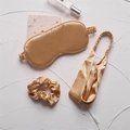 Champagne gold faux silk sleep set featuring eye mask, headband, and scrunchie - Gold