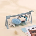 Light blue transparent PVC pencil case with triangular design and secure zipper - Blue
