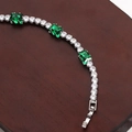 Silver bracelet featuring rectangular emerald stones and round cubic zirconia details - White Gold Green Zirconia