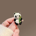 Panda brooch in black and white enamel with green bamboo and gold-tone metal edges - 440# Panda