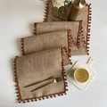 Natural jute table runner with dark orange pompom fringe for elegant dining decor - Jute Brick Red Pom-pom
