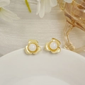 Elegant gold flower stud earrings featuring a lustrous white pearl center in a macro view - Gold Metal Petal Pearl Studs