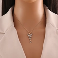Elegant gold butterfly tassel necklace with sparkling drop-shaped clear stones - Light Blue