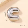 Macro shot of 3D bubble letter C pendant with dimensions 2.6cm by 2.3cm and 20g weight - Silver/Steel (C) (Large)
