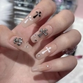 Press-on nails in nude with black crosses, fleur-de-lis, and sparkling rhinestone details - HY292 Nude Chrome Heart Iris