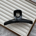 Classic large black shark hair claw clip in a glossy finish on a textured jewelry tray - 13cm Single Hole Flat Clip / Bright Black