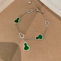 Elegant silver bracelet featuring green malachite wulu charms and sparkling zircon accents - Silver-Green