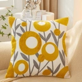 Square cotton pillow with yellow floral tufted embroidery on beige knitted blanket - Calla Lily Pattern