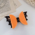 Halloween bat bow hair clip with black glitter wings and orange felt in 45-degree view - Onion Bat Bow Hair Clip