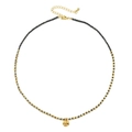 Macro detail of gold-plated hammered pendant with black beads and adjustable lobster clasp - Black
