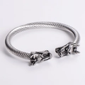 Detail of silver twisted cable bracelet with intricately carved double dragon heads - Steel Cable Steel Dragon Head