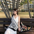 Detail of ethnic style beach shawl with colorful patterns worn over a white lace dress - Ginger-Black White Multicolor Patchwork / 180cm