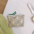 Detail of floral cotton mini pouch with white poodle print and green zipper pull cord - Green Background Dog Floral