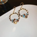 Detailed close-up of vintage flower basket earrings with colorful crystals on a white plate - Silver Earring Post - Colorful