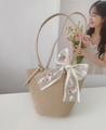 Beige woven bucket bag with long leather straps and a large pink floral lace bow - Khaki Strap With Ribbon