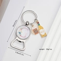 Detail of metal bottle opener keychain with letter G charm and size dimensions - Letter G