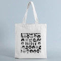 Beige canvas tote bag with black We the People print and faces, on a blue background - STD239-I/Sketch People Group