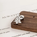 Silver Christmas tree cartilage earring with bow detail and star zircon on wood background - Silver Bow Christmas Tree Style (DZ015-2#)
