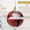 8cm red metal Christmas bell with snowman pattern and star cutouts on hemp rope - 8cm Round Bell (Red Snowman)