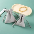 Gray microfiber jewelry drawstring pouch in two sizes on light green background - 5*9cm / Gray