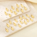 Set de 26 colgantes de letras A-Z en acero inoxidable dorado sobre piedras texturizadas - Colgante-Letra A / Dorado